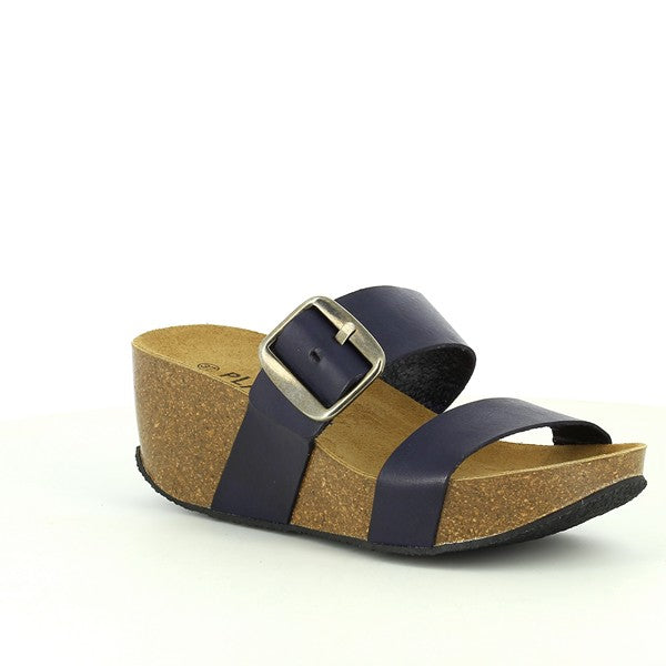 Behold the sleek side profile of Plakton's 273004 Navy Wedge Sandals. Crafted with premium natural leather and featuring a contoured cork footbed, these sandals epitomize comfort and style. Elevate your ensemble with sustainable sophistication. 